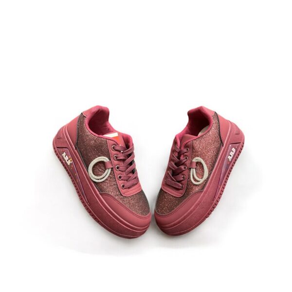 Soft sole classic style girl sneakers in a vibrant red color with a glitter finish and decorative detailing, designed for comfort and style.